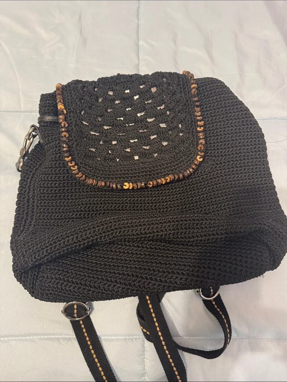 The Sak Black Woven Backpack with Tassel and Bead Accent